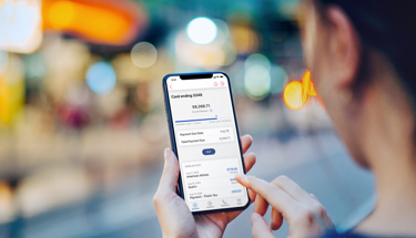 reviewing card purchases on mobile phone